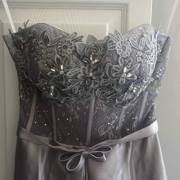 This is a beautiful long sleeveless silver prom dress with elegant lace details. - Picture 3 of 4